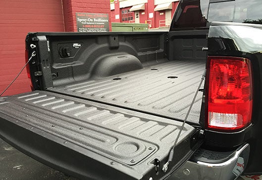 Black truck with Bullet spray on truck bed liner